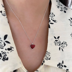 Elegant 925 sterling silver necklace featuring a vivid red heart pendant on a thin O-chain