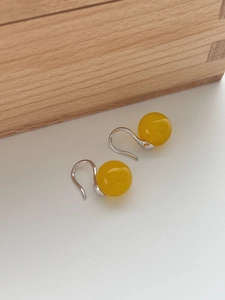 Detailed view of yellow agate bead earrings with minimalist 925 sterling silver hooks