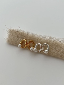 Detailed view of S925 silver irregular oval earrings with freshwater pearls in gold and silver