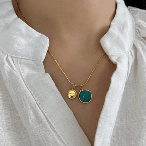 French style 925 silver necklace featuring green turquoise bead and gold disc charms