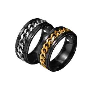 Men's black stainless steel spinner rings featuring gold and silver Cuban chain inlay detail
