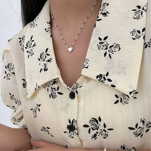 Minimalist S925 sterling silver heart pendant necklace with black beads on model