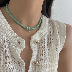 Handmade 925 silver beaded necklace with mint green beads and textured hollow heart pendant