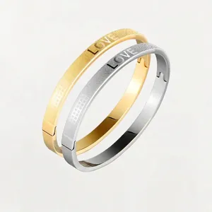 Retro stainless steel LOVE bracelets set in gold and silver finish with matte texture