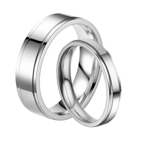 Minimalist pair of silver stainless steel couple rings with sleek concave line design