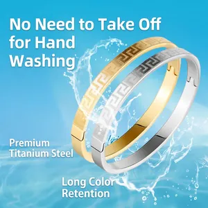 High-quality titanium steel bangles with Greek key pattern in gold and silver finishes