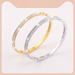 Sparkling crystal paved stainless steel bangles in gold and silver finish set
