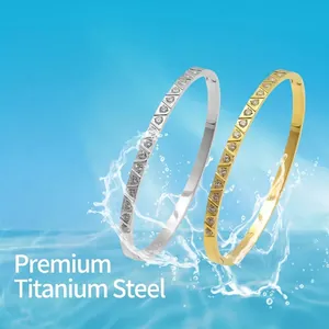 Premium titanium steel bangles in gold and silver with sparkling triangular diamond accents