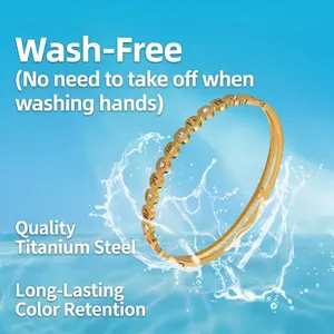 Gold titanium steel bracelet with Roman numerals, wave patterns, and sparkling crystals