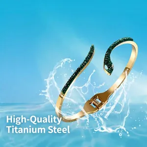 Gold titanium steel snake bracelet with green zircon inlay in a water splash setting