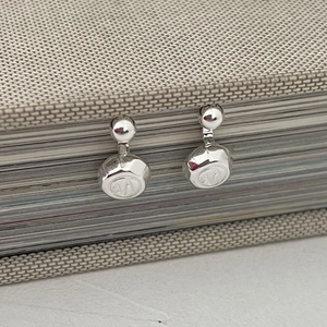 Minimalist 925 sterling silver drop earrings featuring polished round M-letter pendants