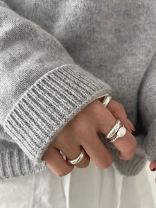 925 sterling silver minimalist rings styled with a cozy knit sweater for a premium winter look