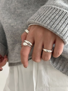 Minimalist 925 sterling silver rings with polished and matte finish on a model