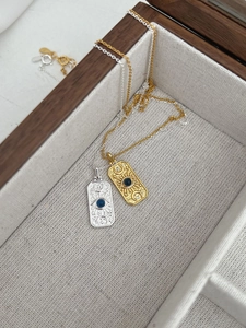 Detailed view of S925 sterling silver stamp on vintage sun and moon pendant necklaces