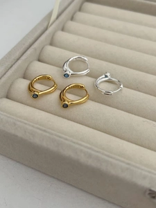 Close-up of S925 sterling silver hoop earrings with blue zircon in gold and silver plating