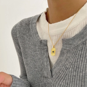 S925 sterling silver long necklace with a vintage gold pendant and a blue gemstone charm