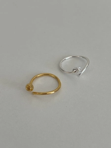 Close-up of S925 sterling silver hallmark inside the open rose ring bands