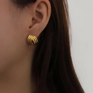 Boucles d'oreilles élégantes en argent 925 doré avec design géométrique à spirales
