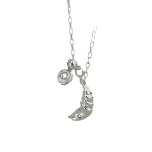Minimalist silver croissant pendant necklace with textured finish and adjustable chain