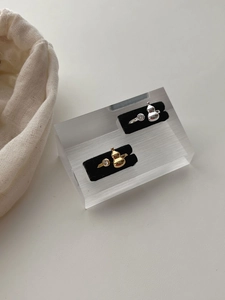 Close-up of 925 sterling silver gourd rings with gold and silver finishes and rhinestones