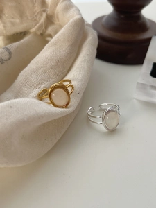 Detail of S925 sterling silver double-layer rings with oval white agate stones