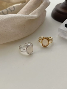Close-up of vintage S925 silver double-layer rings with oval white agate stones