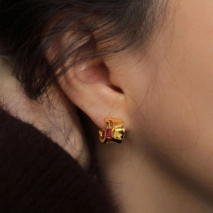 925 silver gold earrings featuring a rectangular pink gemstone on a model's ear