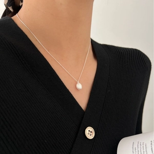 Elegant S925 sterling silver frosted ball pendant necklace worn on a female model
