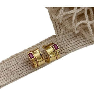 French vintage 925 silver gold hoop earrings with pink cube stone on knit background
