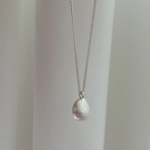 Minimalist S925 sterling silver necklace with a matte brushed teardrop pendant for women