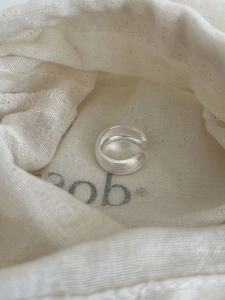 Macro shot of minimalist S925 sterling silver ring with a frosted matte finish texture