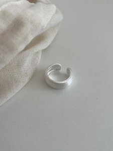 Detail of S925 sterling silver ring showing matte sandblasted texture and hallmark