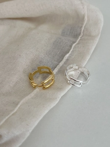 Detailed view of gold and silver S925 sterling silver hollow geometric link rings