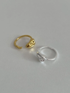 Detailed macro view of S925 sterling silver rings with irregular liquid metal texture
