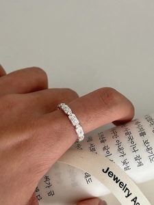 Macro shot of S925 silver retro lace hollow ring with square diamond modular design