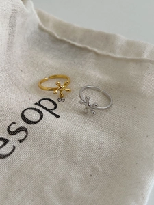 Macro detail of molten irregular S925 silver rings in gold and silver finish