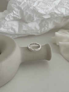 Detailed macro view of S925 silver retro hollow lace ring with geometric relief textures