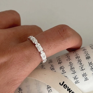 Elegant vintage hollow S925 silver lace ring with diamonds shown on model's finger