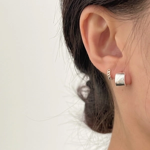 Minimalist S925 sterling silver hoop earrings with zircon star on model ear