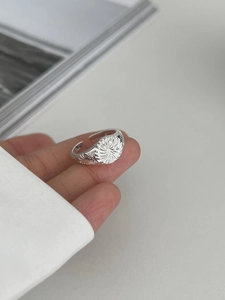 Detailed close-up of a S925 sterling silver sunray engraved adjustable open ring