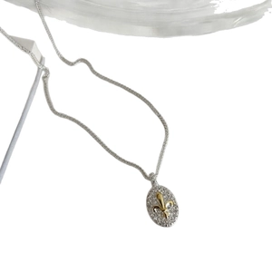 Retro luxury oval fleur-de-lis necklace with sparkling crystal pave in silver tone