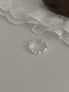Close-up of S925 sterling silver geometric ring with micro-set zircons and textured band
