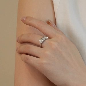 Exquisite S925 sterling silver wheat ear ring with pearls shown on female index finger