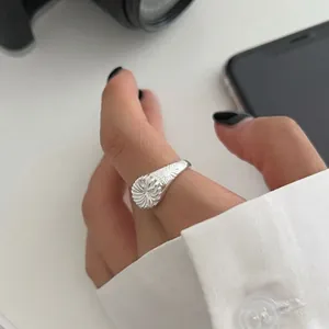 S925 sterling silver sunburst ring featuring intricate radial lines in a retro style