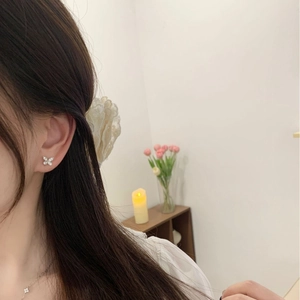 Elegant 925 sterling silver butterfly stud earrings with rhinestones on female model