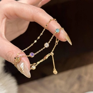 Bracelet double couche doré avec pierres de zircon colorées et cordon de serrage réglable