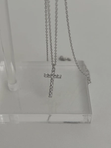 Detail view of 925 silver cross pendant necklace with micro-pave cubic zirconia