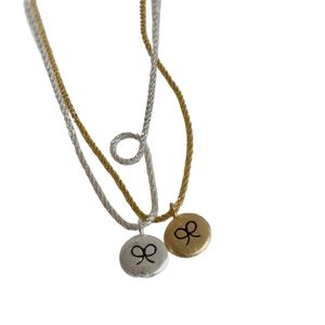 Brushed silver and gold round coin necklaces with engraved bow pattern for daily wear