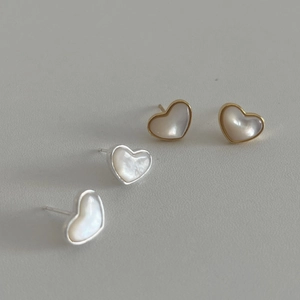 Minimalist heart-shaped mother of pearl stud earrings in gold and silver finish