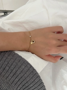 Close-up of S925 silver gourd bracelet with tiger eye stone on model's wrist